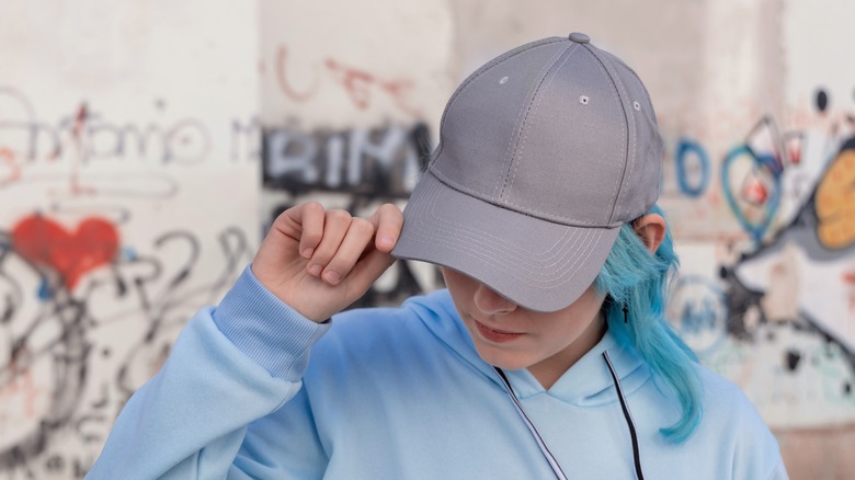 stylish girl wearing hat and hoodie