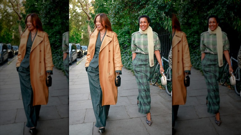 Two women wearing earthy tones and plaid