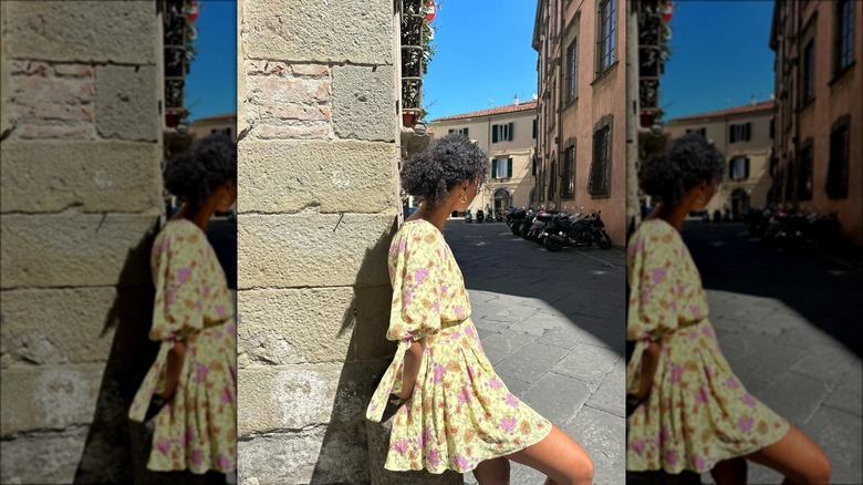 Woman wearing yellow dress with pink flowers