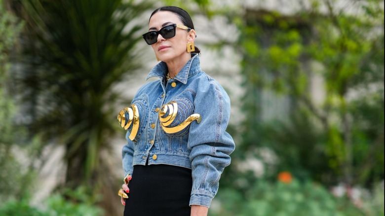 woman wearing jacket with metal