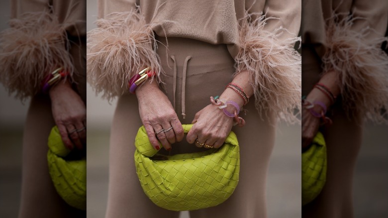 Woman with feather-trimmed sleeves