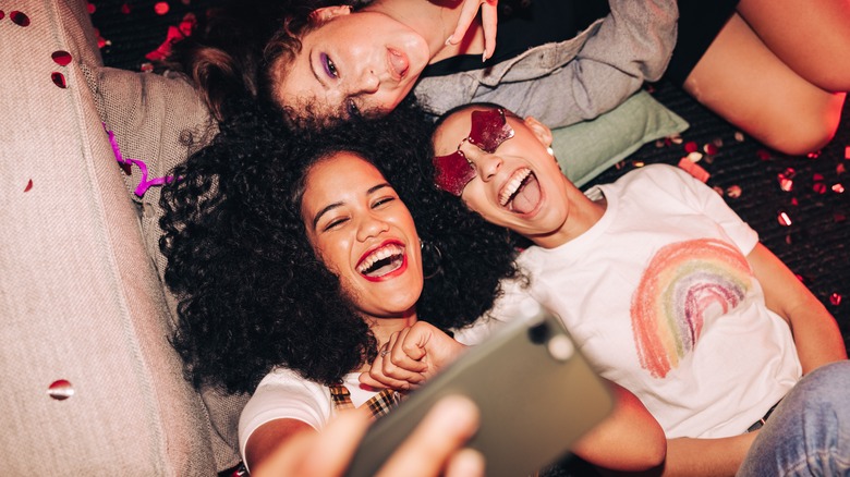 three women taking selfie