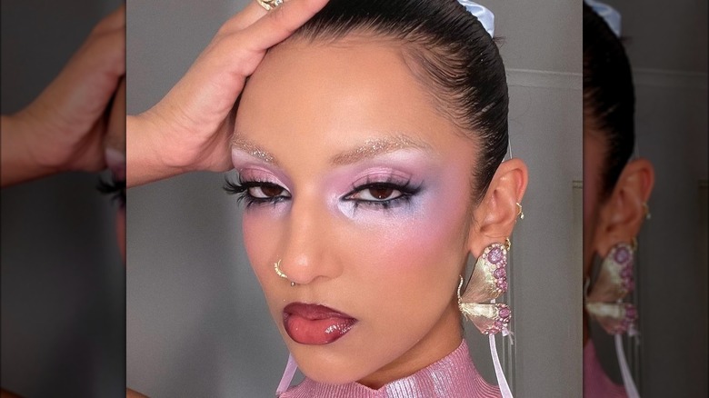 A woman with glittery eyebrows