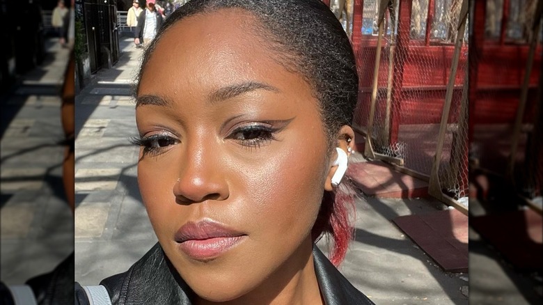 A woman with edgy black makeup