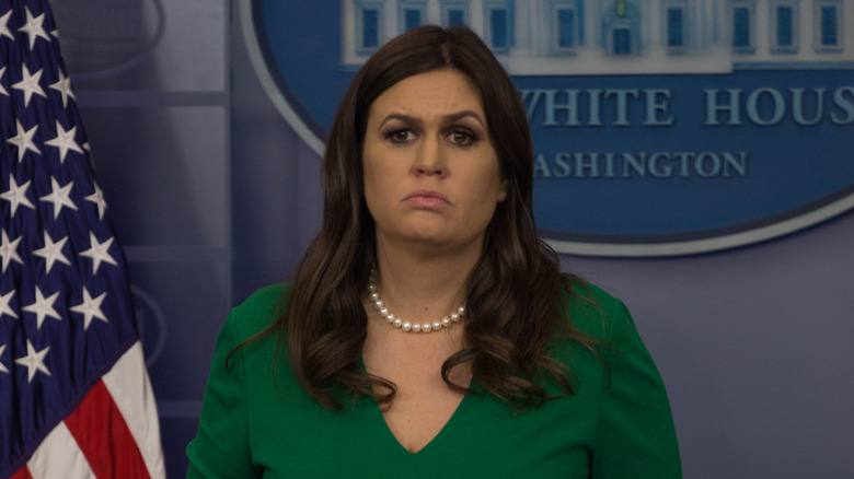Sarah Huckabee Sanders wearing a green shirt