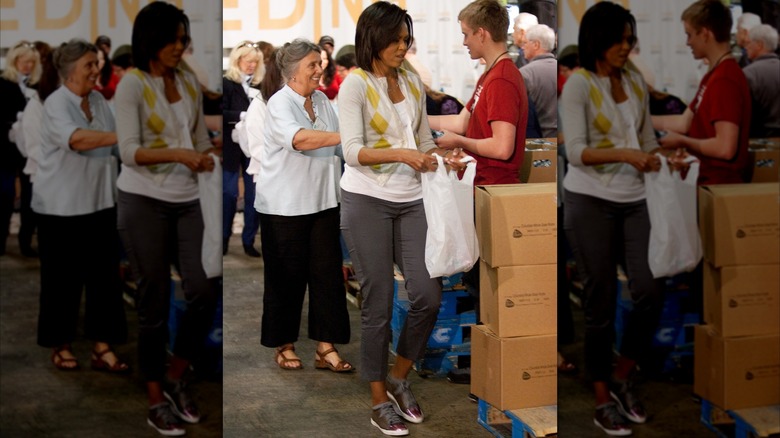 Michelle Obama in 2009 holding a bag