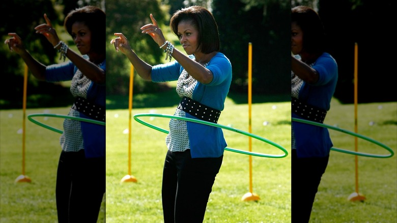Michelle Obama in 2009 using a hula hoop