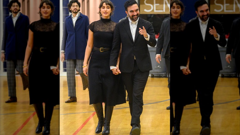 Rama Duwaji wearing a black dress and walking out of the voting center