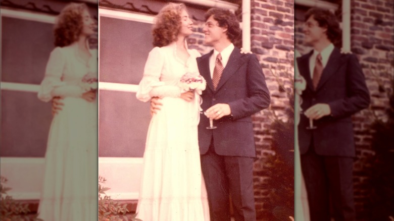 Bill and Hillary Clinton stand side by side on their wedding day