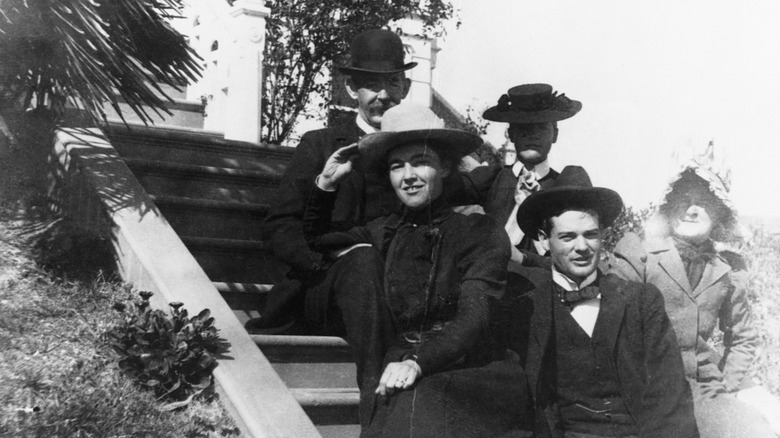 Herbert Hoover and wife Lou Henry sit on the porch with family on their wedding day