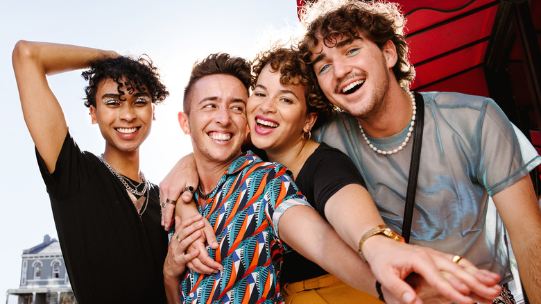 Queer friends smiling