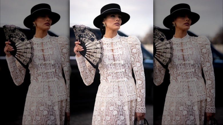 woman with a lace folding fan