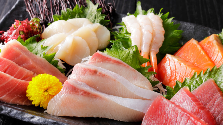 Assorted sashimi platter on black background