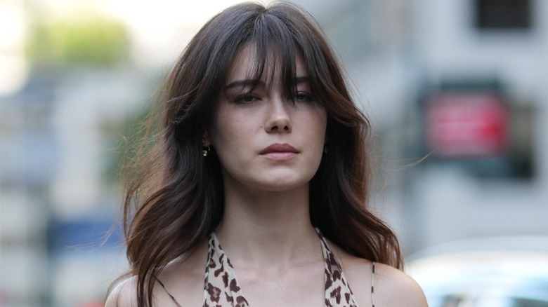 A guest at fashion week with long bangs