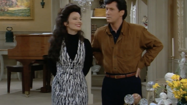 Fran Fine stands next to Mr. Sheffield in a zebra print mini dress