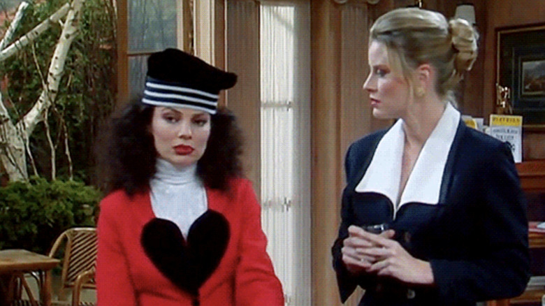 Fran Fine and CC Babcock stand side by side in an office room