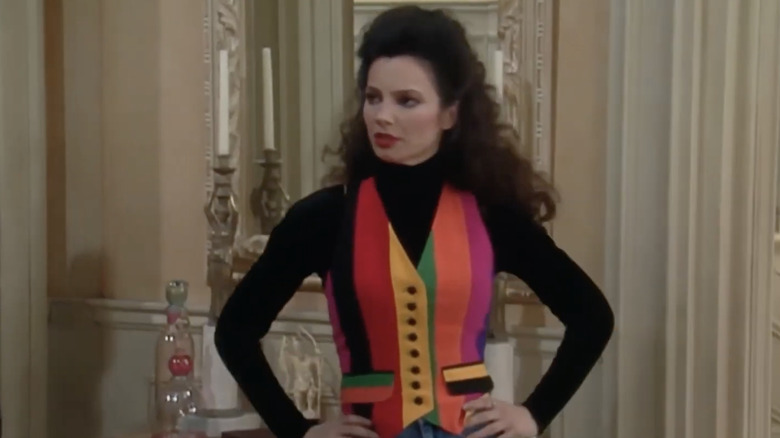 Fran Fine in a rainbow colored vest