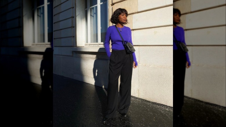 Woman wearing purple and black