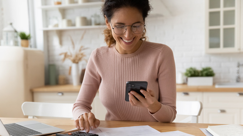 woman looking her phone