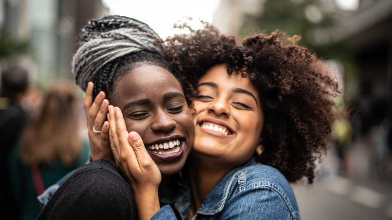 Two friends hugging