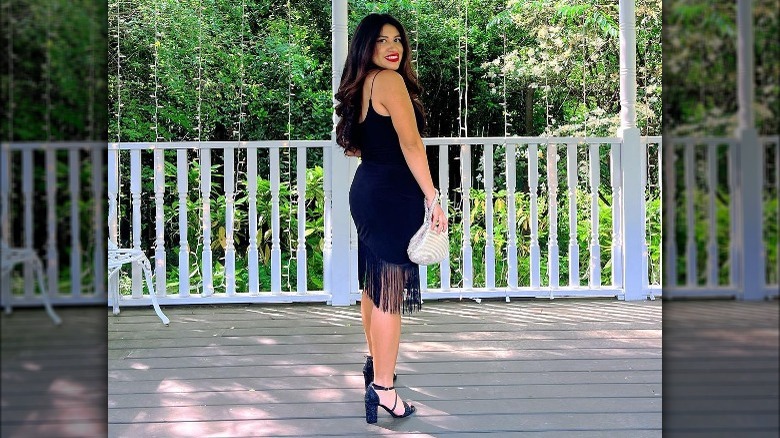 Woman in LBD, fringed hem