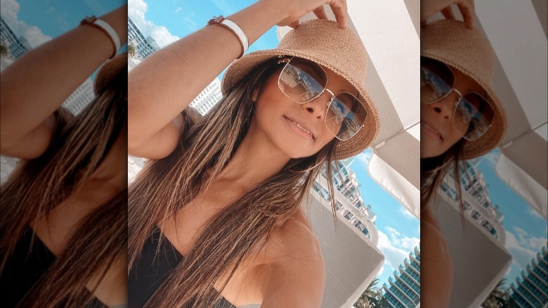 Girl wearing a raffia bucket hat