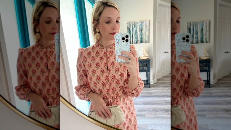 Woman wearing raffia drop earrings