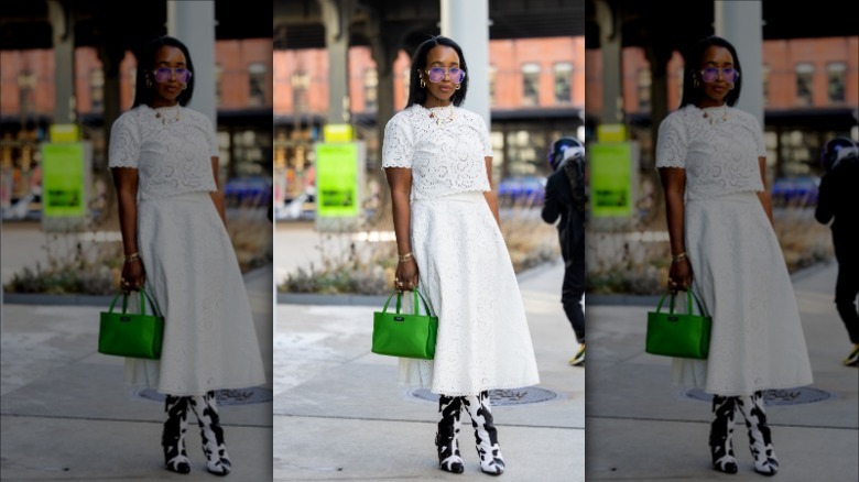woman wearing a lace crop top and full skirt
