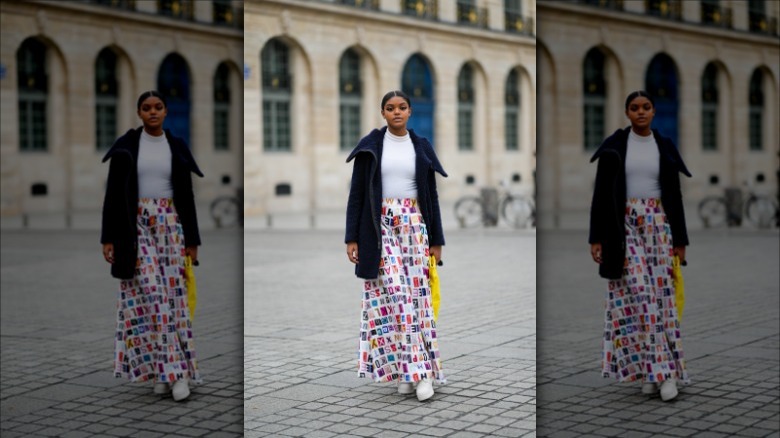 woman wearing a white shirt and printed full skirt