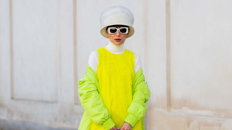 White fur hat neon yellow dress