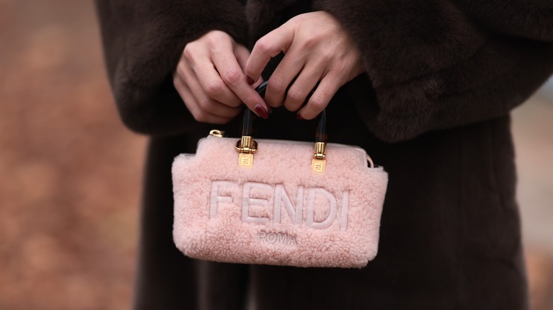 Sonia Lyson carrying fuzzy Fendi handbag