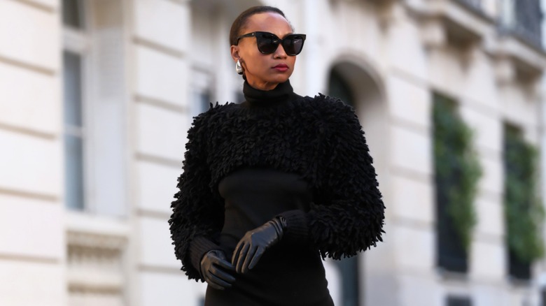 Emilie Joseph wearing fuzzy black bolero