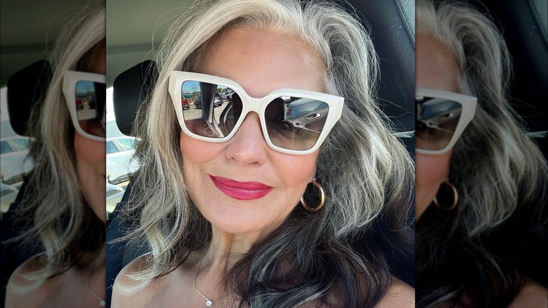 Woman wearing white sunglasses