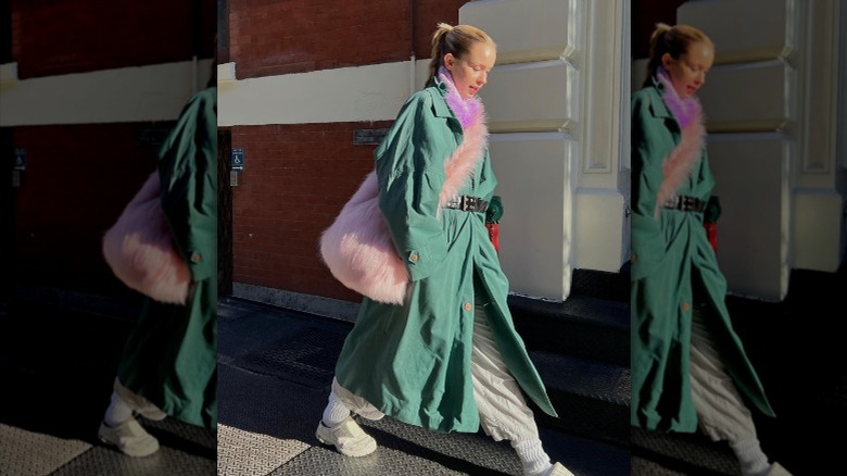 woman wearing furry tote