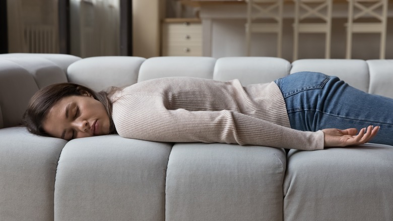 Woman lying on sofa