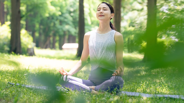 Woman meditating outside