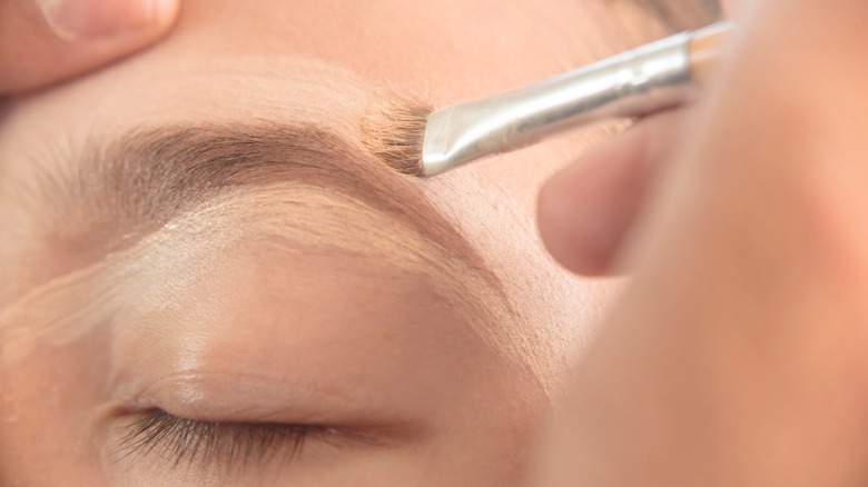 Eyebrow being hightlighted with concealer