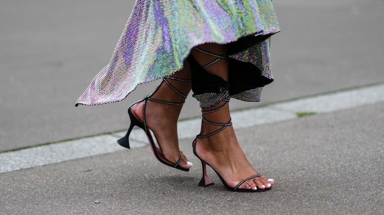 woman wearing black gladiator sandals