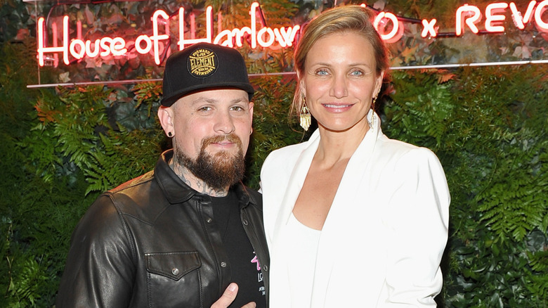 Benji Madden and Cameron Diaz posing for a photo at House of Harlow 1960 x REVOLVE