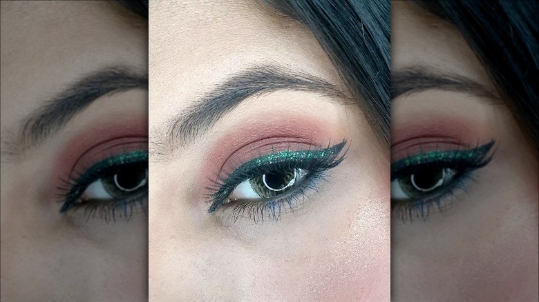 woman wearing green eyeliner