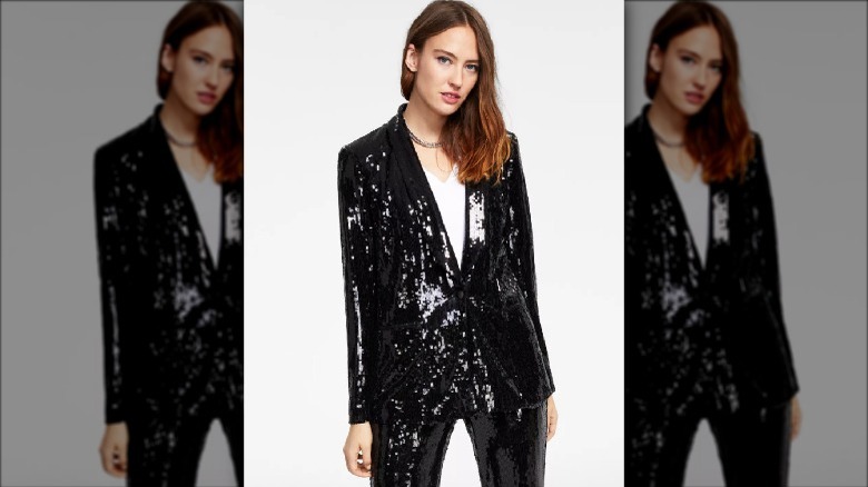 model wearing black sequin blazer