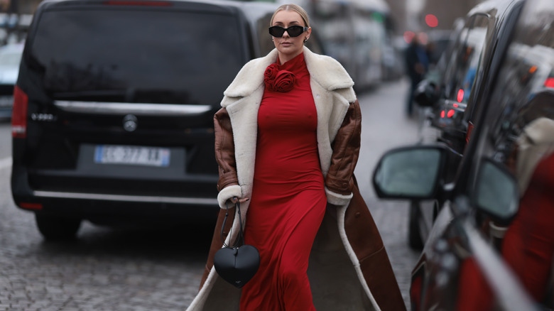 Woman wearing red dress and coat
