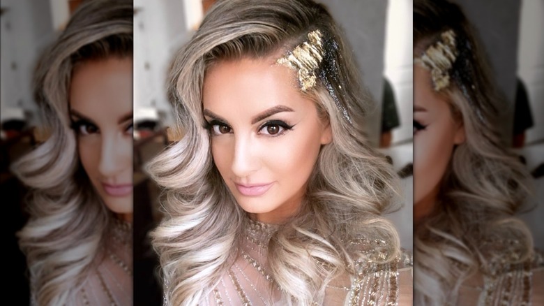 Woman with gold leaf on side part