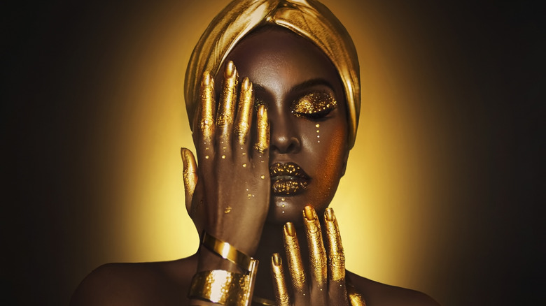 Woman covered in gold jewelry