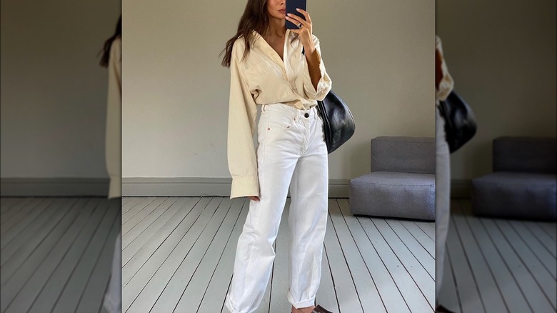 woman wearing a yellow linen shirt and white pants