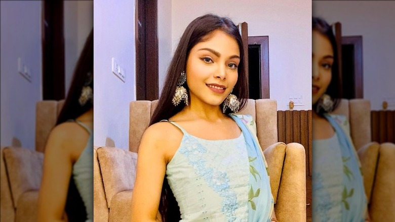 Woman wearing statement earrings