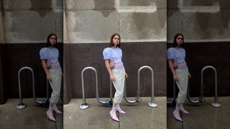 woman standing against wall