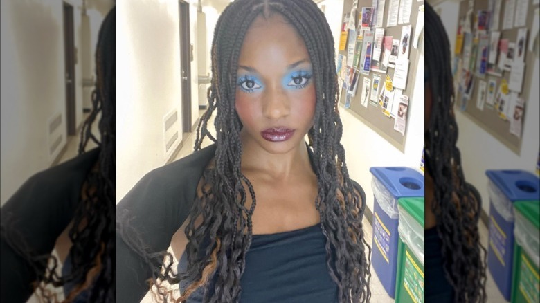 blue eyeshadow and heavy mascara