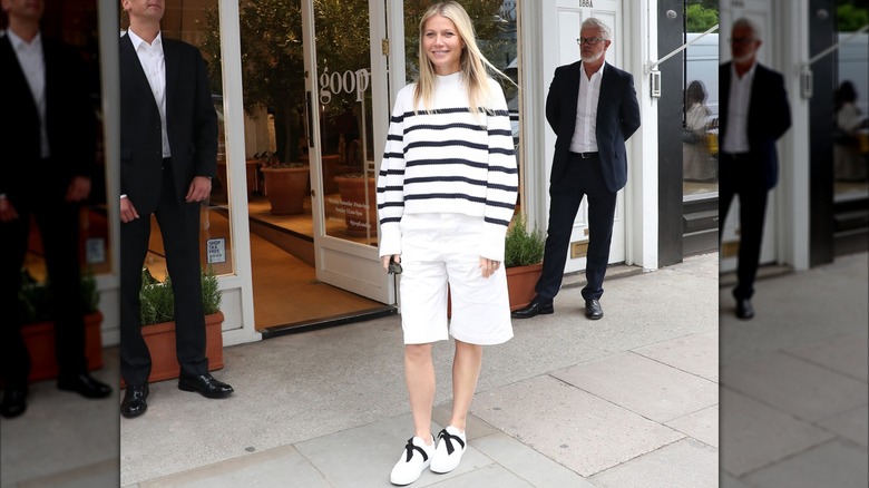 Gwyneth Paltrow wearing a striped sweater with Bermuda shorts at Goop event in 2019