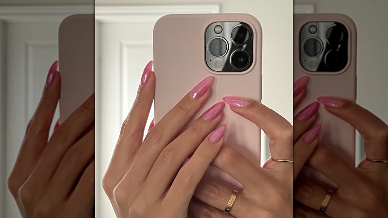 shimmery pink pearl nails on hand